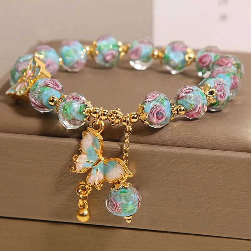 Women's rose garden bracelet with coloured glaze butterfly charm in blue, Japanese Korean style