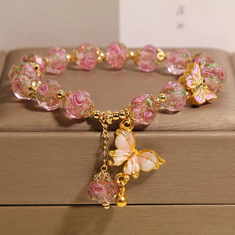 Women's rose garden bracelet with coloured glaze butterfly charm in blue, Japanese Korean style