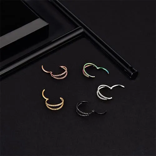 Close-up of a G23 titanium alloy lip ring with a diamond zircon finish in gold colour.