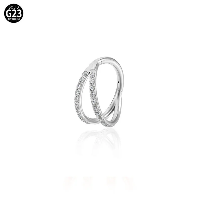 Close-up of a G23 titanium alloy lip ring with a diamond zircon finish in gold colour.