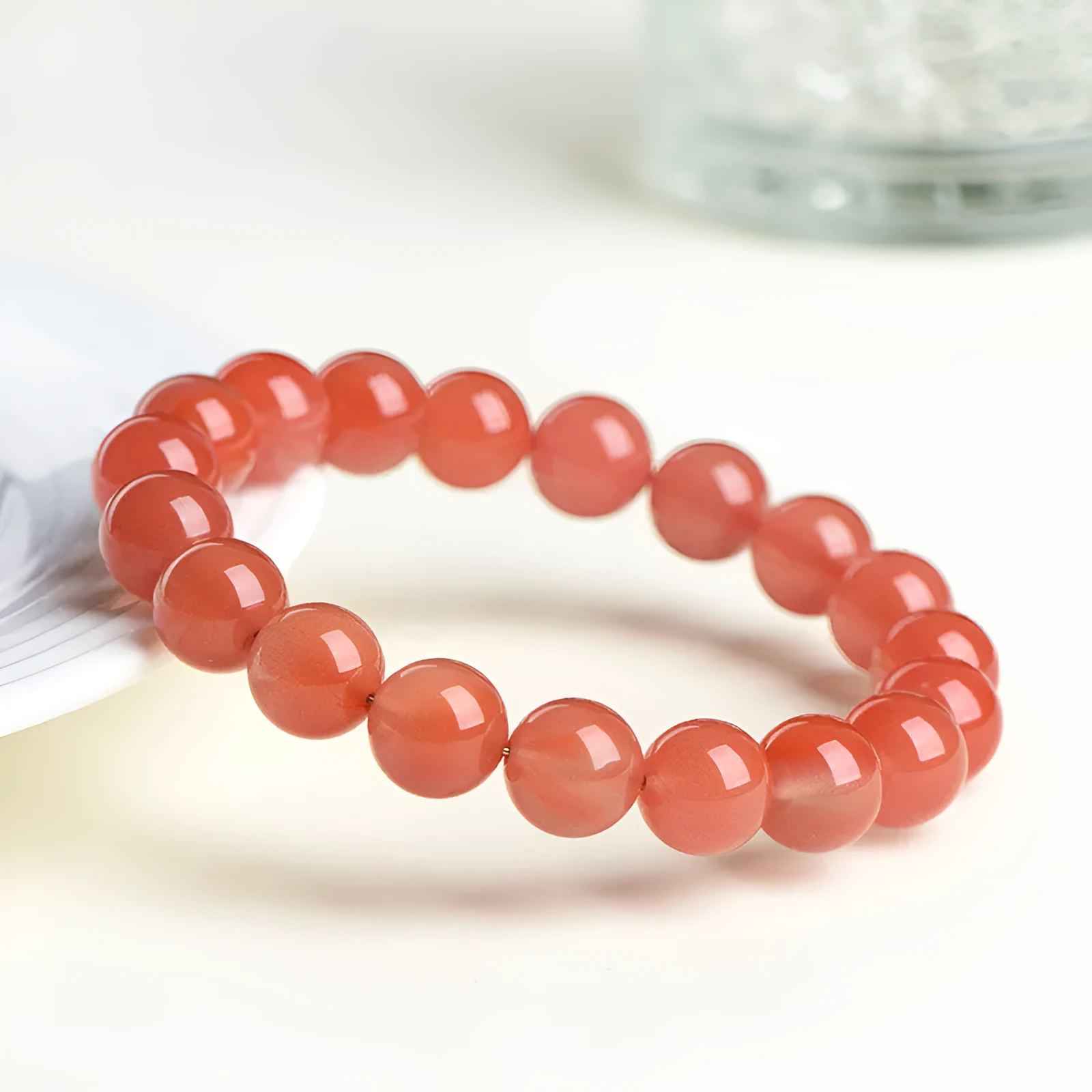 Natural cherry red agate bracelet with polished scattered beads, shown in a single circle style.
