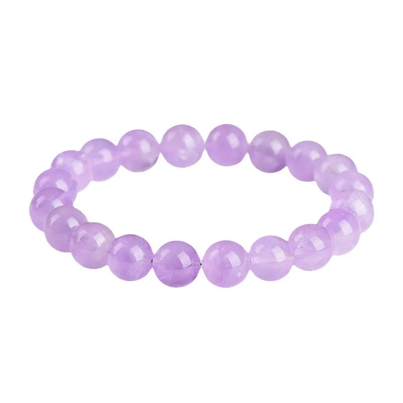 Lavender round amethyst crystal bead bracelet with water ripple design on a wrist.