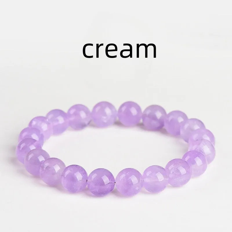 Lavender round amethyst crystal bead bracelet with water ripple design on a wrist.