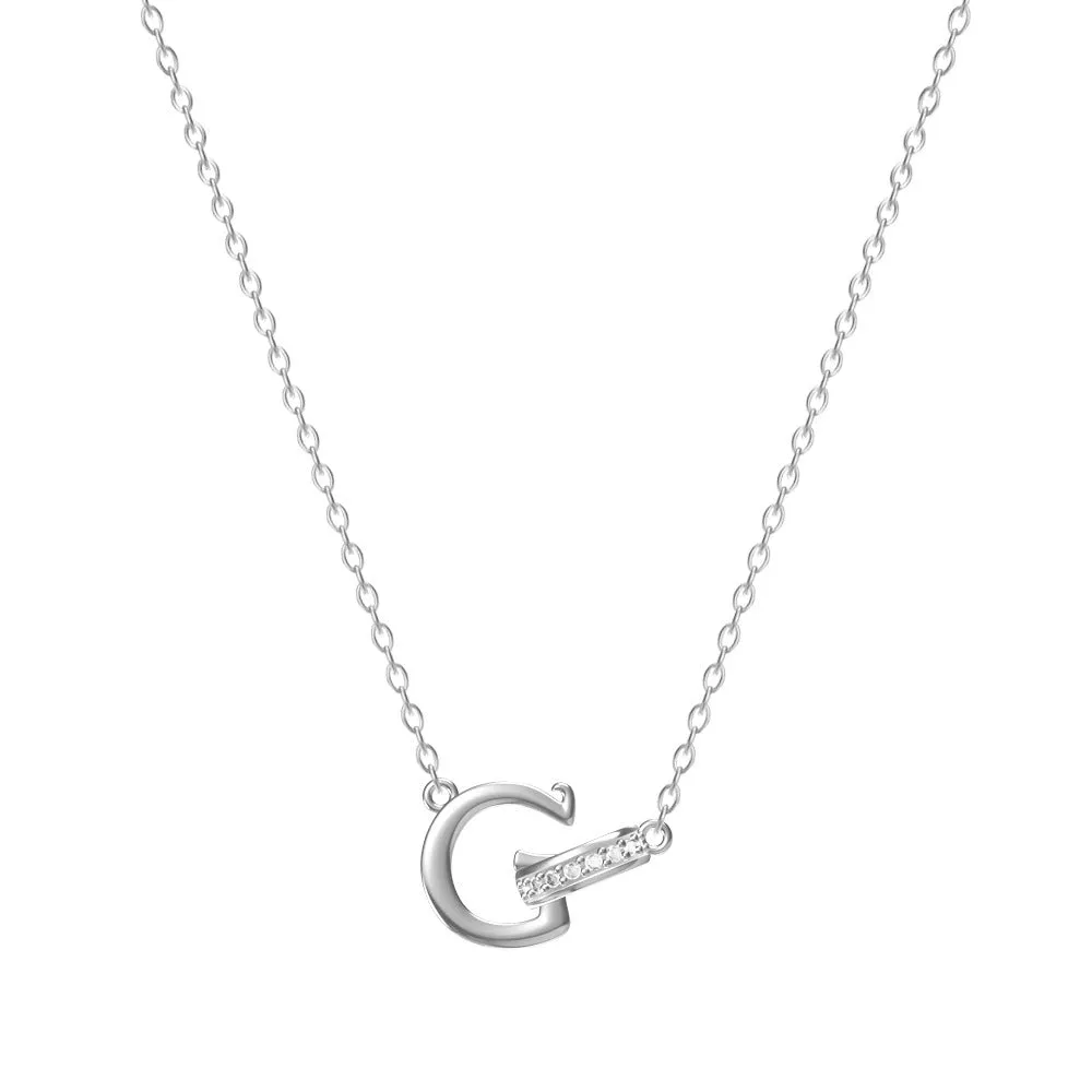 Women's 26-letter initial necklace in titanium steel with a round zircon pendant on a cross chain, colour option shown