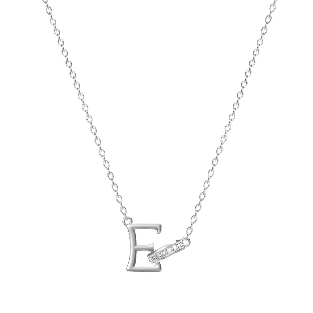 Women's 26-letter initial necklace in titanium steel with a round zircon pendant on a cross chain, colour option shown