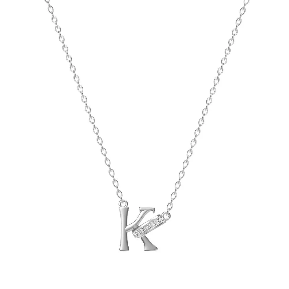 Women's 26-letter initial necklace in titanium steel with a round zircon pendant on a cross chain, colour option shown