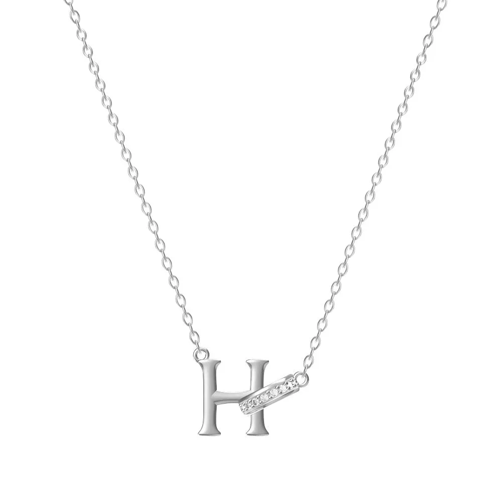 Women's 26-letter initial necklace in titanium steel with a round zircon pendant on a cross chain, colour option shown