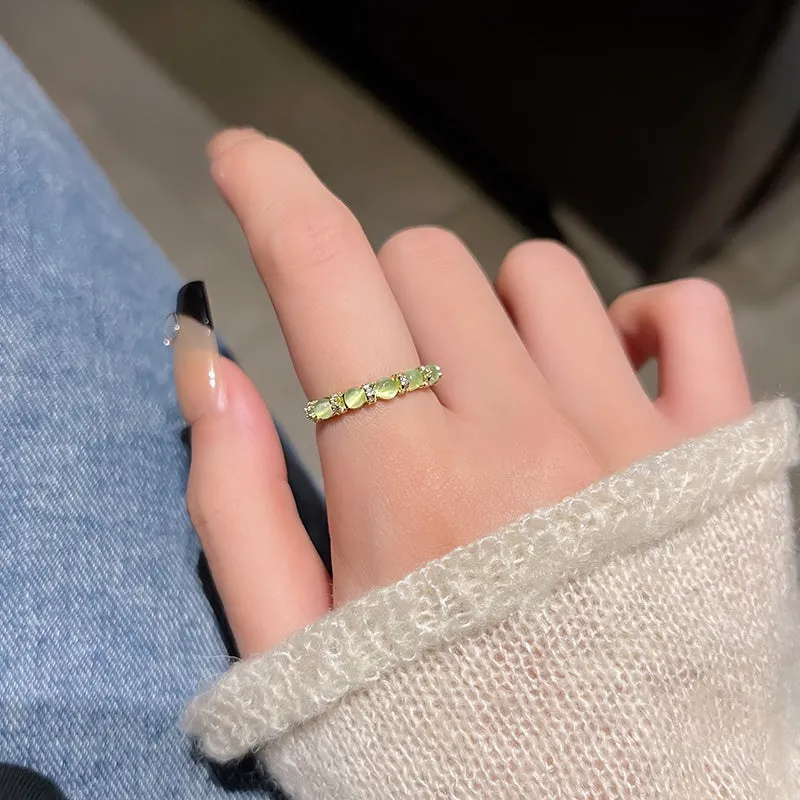Geometric bow adjustable open ring in copper with electroplated gold finish on finger