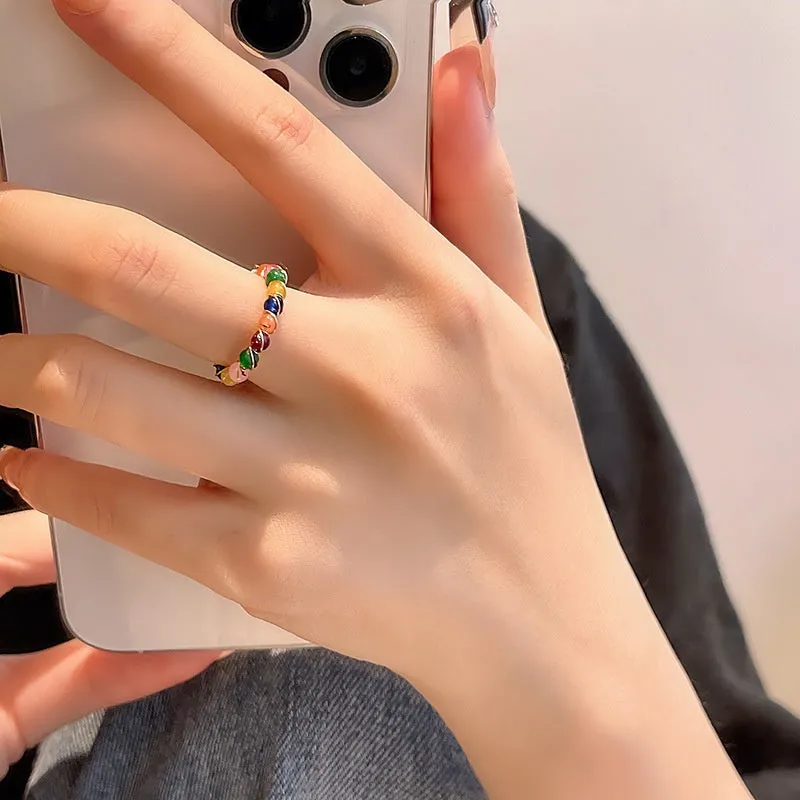 Geometric bow adjustable open ring in copper with electroplated gold finish on finger