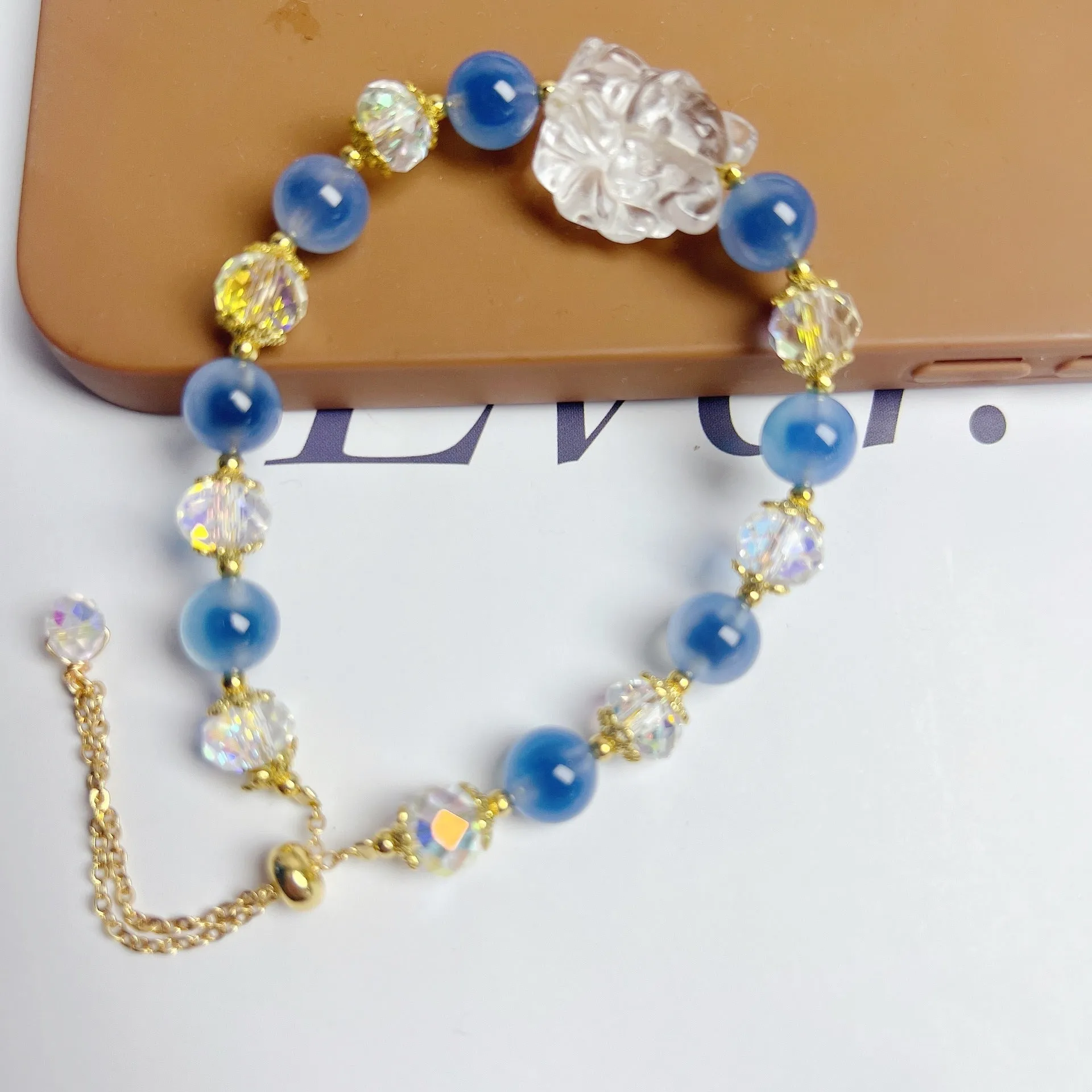 Handmade blue glazed agate nine tail fox bracelet on white background