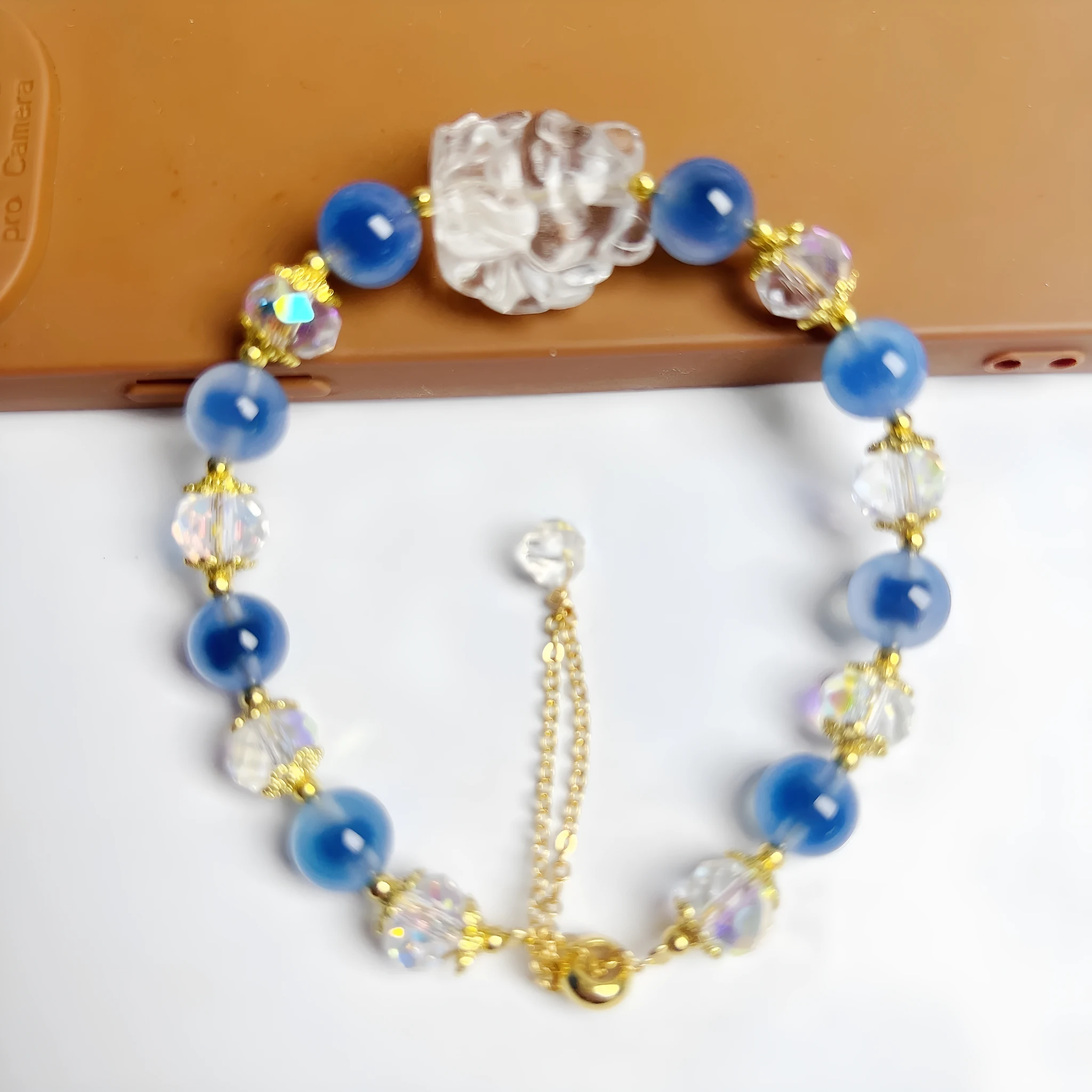 Handmade blue glazed agate nine tail fox bracelet on white background