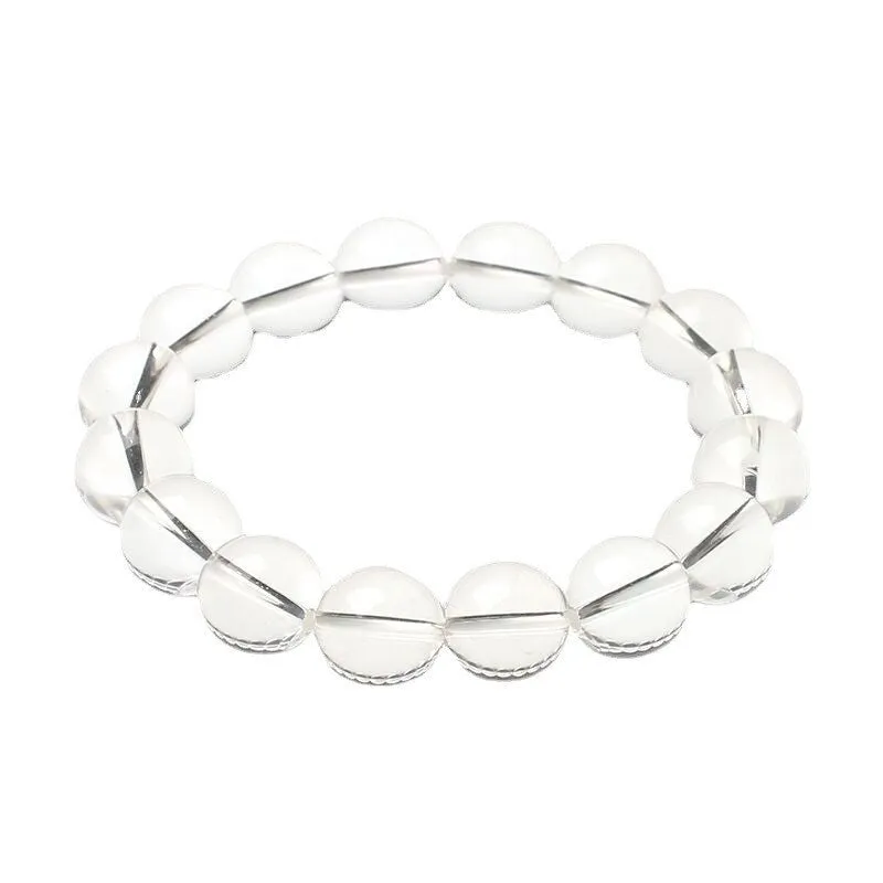 Natural old mine white crystal bracelet with round geometric beads on a wrist.