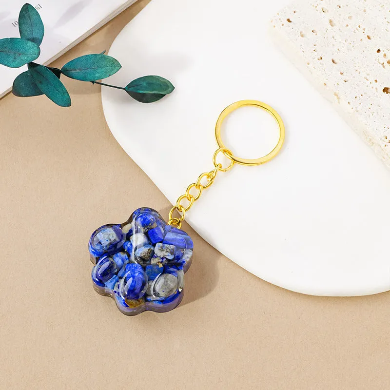 Natural crystal cat's paw keychain pendant in a chosen gemstone like turquoise or amethyst.