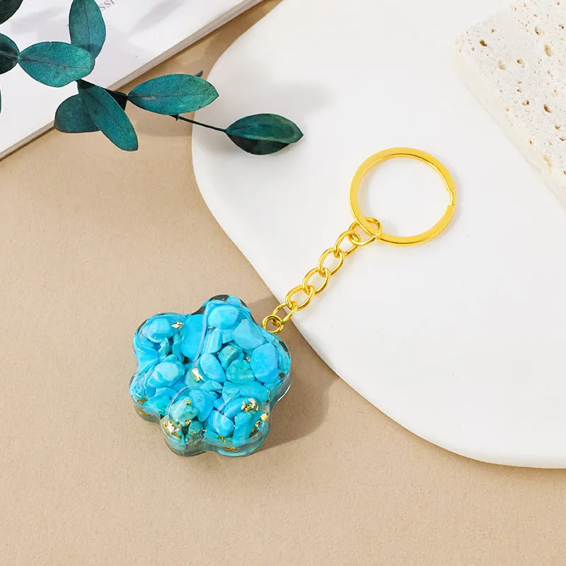 Natural crystal cat's paw keychain pendant in a chosen gemstone like turquoise or amethyst.