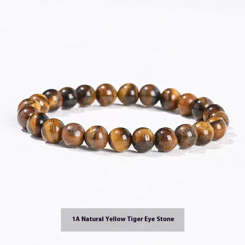 Natural tigereye crystal bracelet with yellow tiger eye beads approximately 8mm diameter on elastic cord