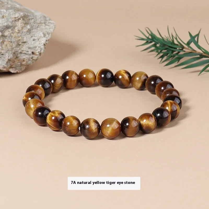 Natural tigereye crystal bracelet with yellow tiger eye beads approximately 8mm diameter on elastic cord
