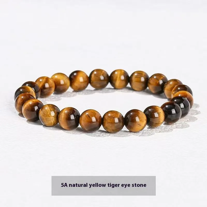 Natural tigereye crystal bracelet with yellow tiger eye beads approximately 8mm diameter on elastic cord