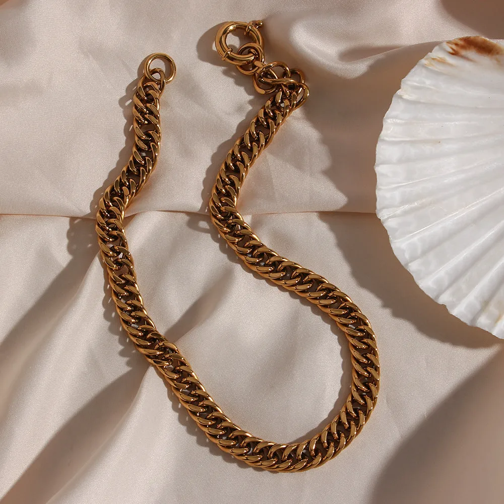 Stainless steel 18K plated gold clavicle necklace with thick encrypted chain and OT buckle on white background