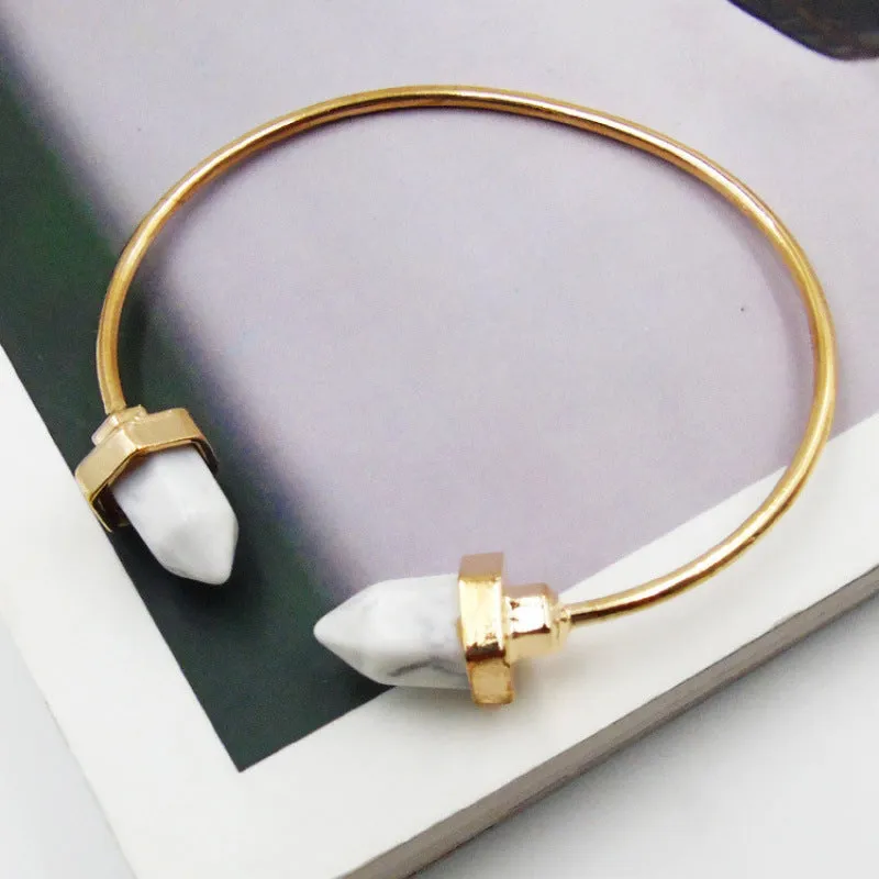 Natural alloy open-ended bracelet with inlaid gem turquoise style in silver blue finish on a neutral background