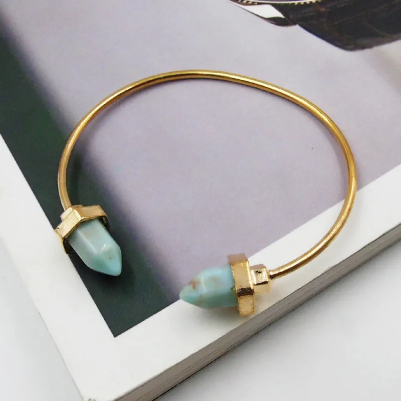Natural alloy open-ended bracelet with inlaid gem turquoise style in silver blue finish on a neutral background