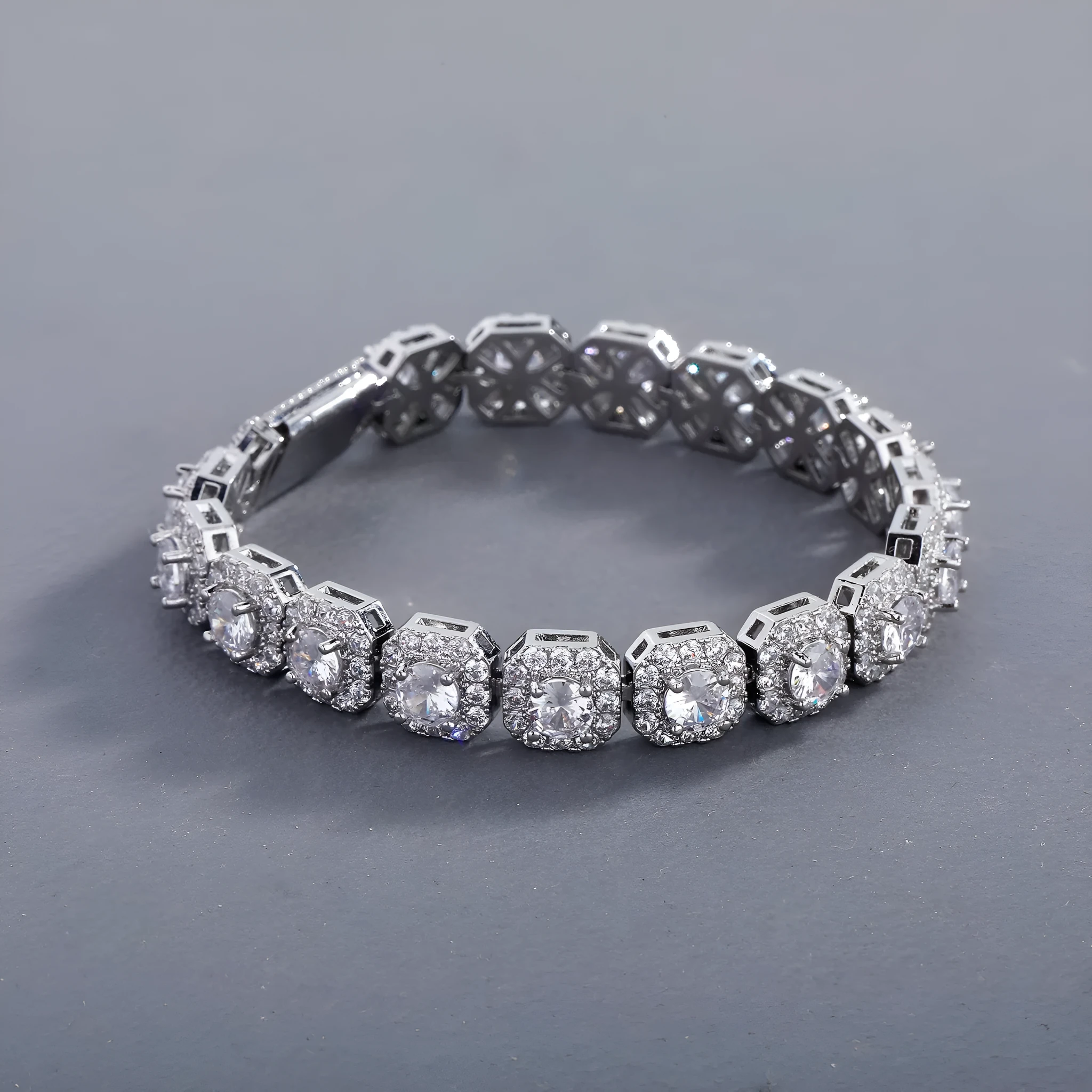 Men's silver zircon flip Cuban chain bracelet on wrist showing inlaid zircon and clasp detail