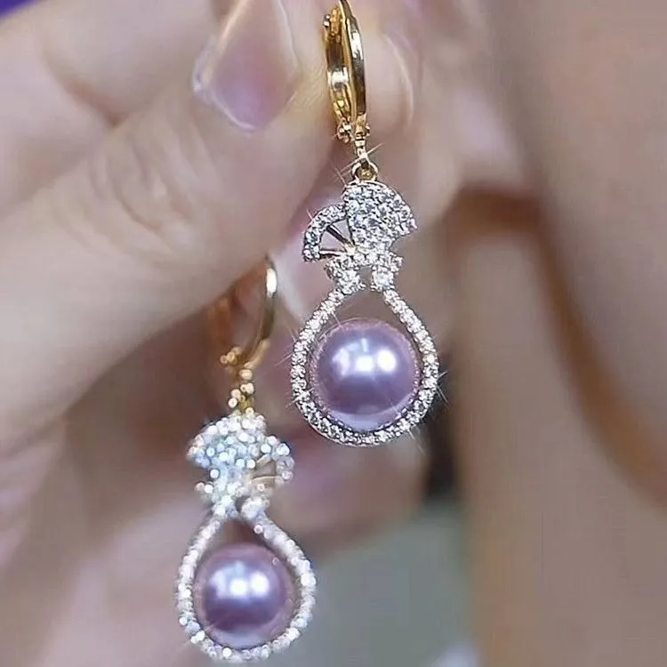 Purple alloy drop shape ear clip with crown design and electroplated finish for women