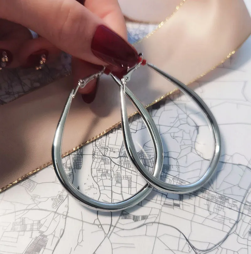 Matte gold geometric ellipse alloy earrings with electroplated finish, vintage French cold wind style for women