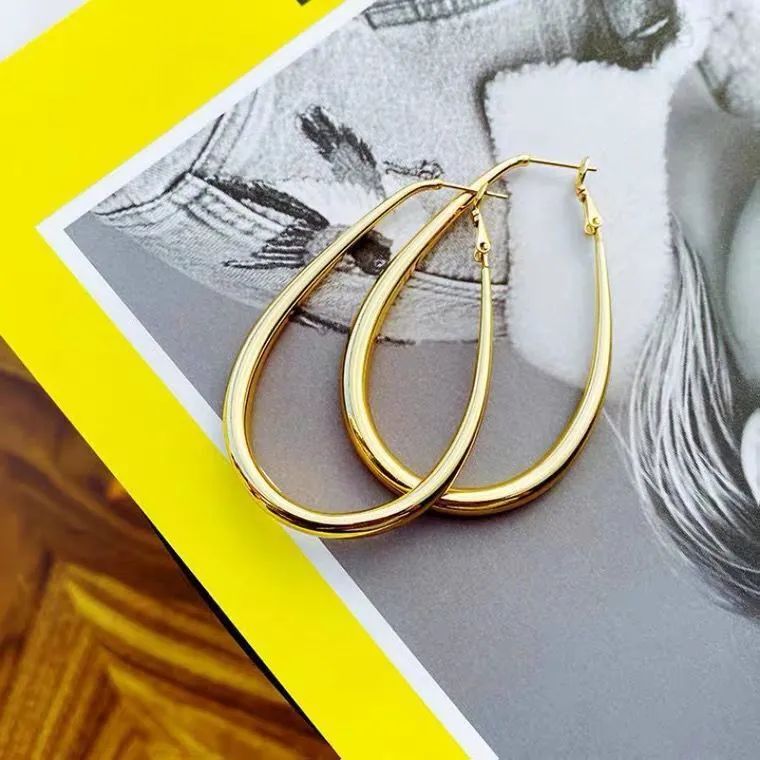 Matte gold geometric ellipse alloy earrings with electroplated finish, vintage French cold wind style for women