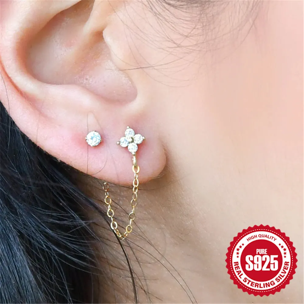 S925 sterling silver flower-shaped earring with a dangling chain tassel in a gold colour finish.