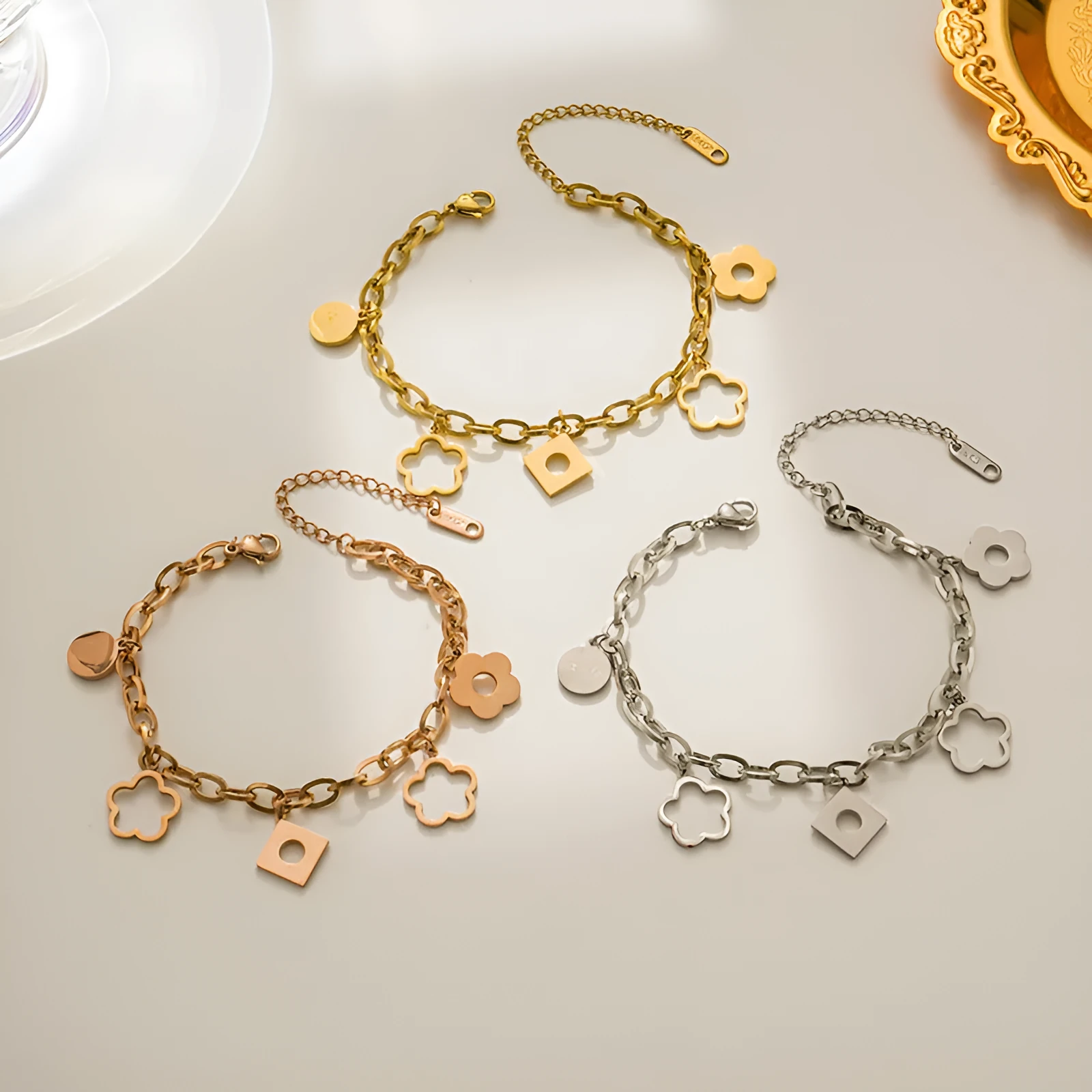 Titanium steel flower pendant bracelet for women, electroplated gold finish, diamond-shaped charm