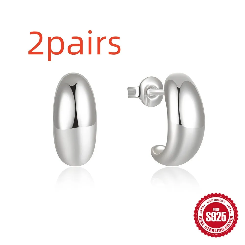 Sterling silver C-shaped stud earring with glossy electroplated gold finish