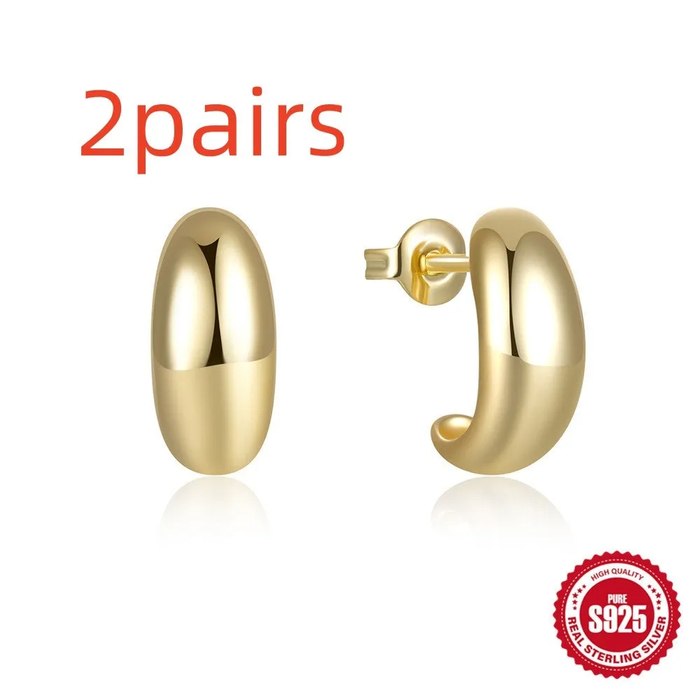 Sterling silver C-shaped stud earring with glossy electroplated gold finish