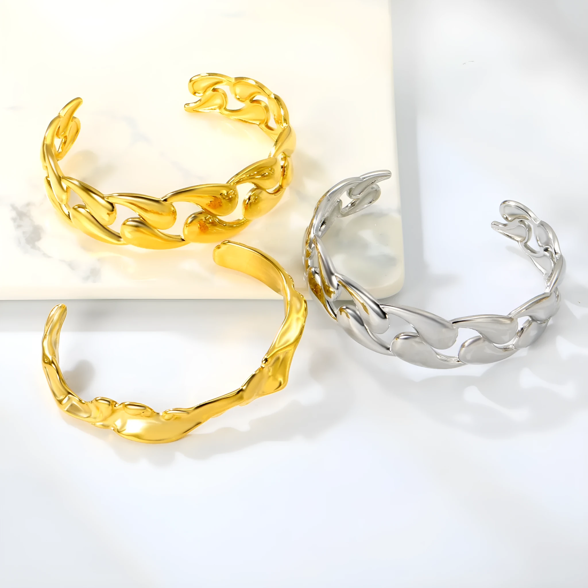 Stainless steel alloy bracelet in gold or silver tone for European American trend styling.