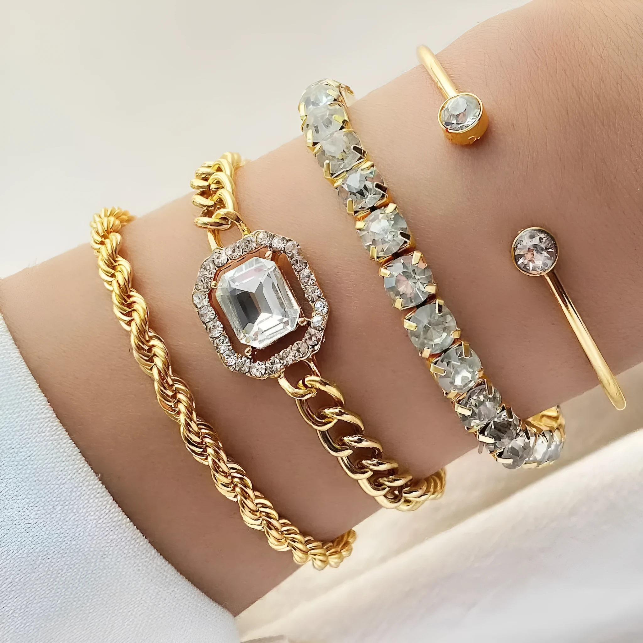Retro geometric alloy four-piece jewellery set showing bracelet, earrings, necklace and ring with square diamond chain designs