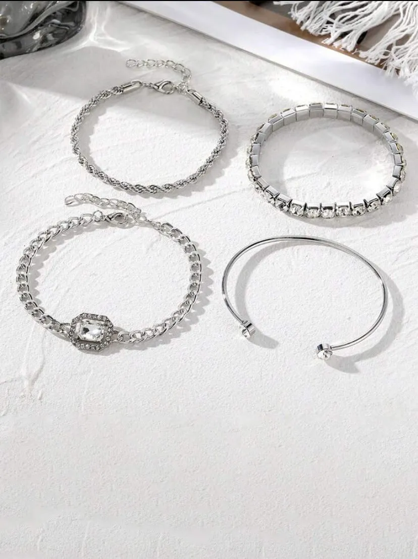 Retro geometric alloy four-piece jewellery set showing bracelet, earrings, necklace and ring with square diamond chain designs