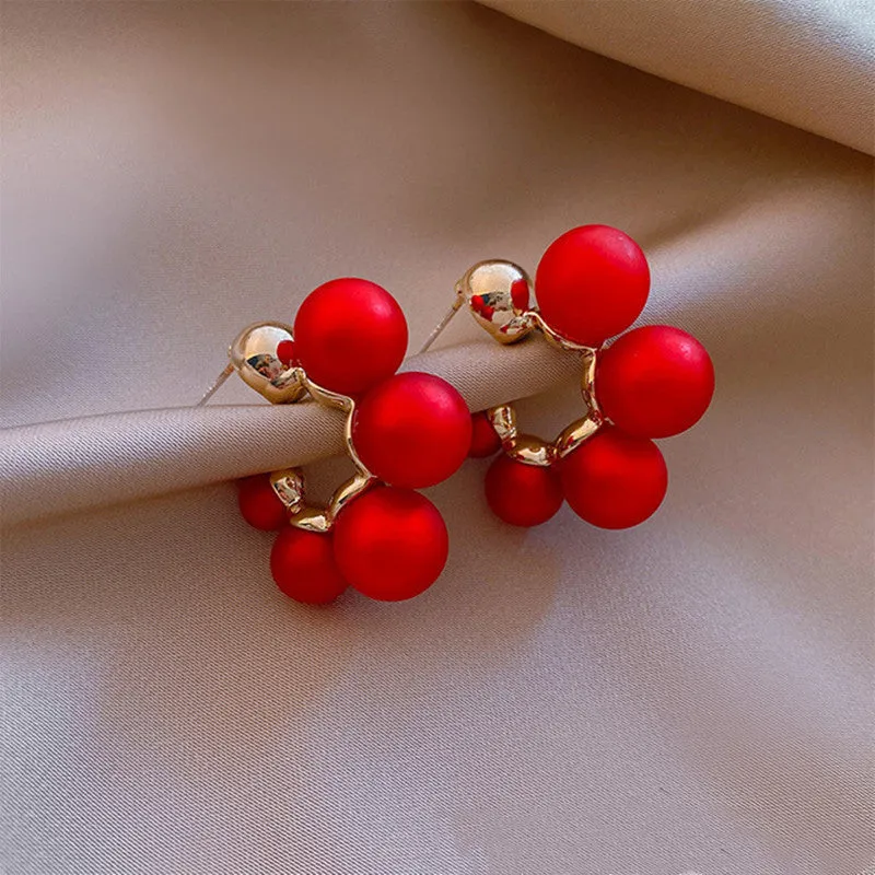 Red bell-shaped alloy earrings for women shown alongside white colour option