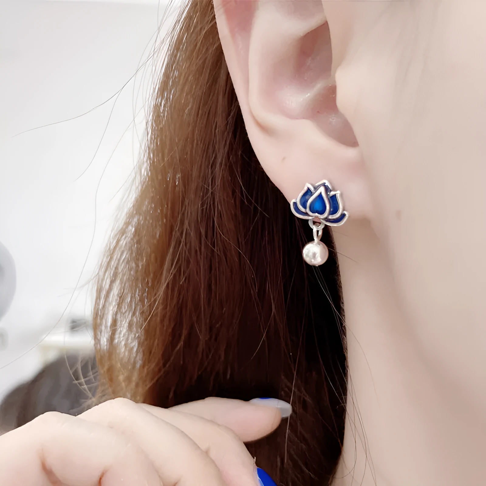 Blue lotus seedpod tassel ear studs with floral design on silver needle fittings