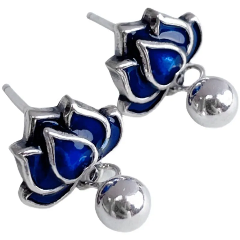 Blue lotus seedpod tassel ear studs with floral design on silver needle fittings