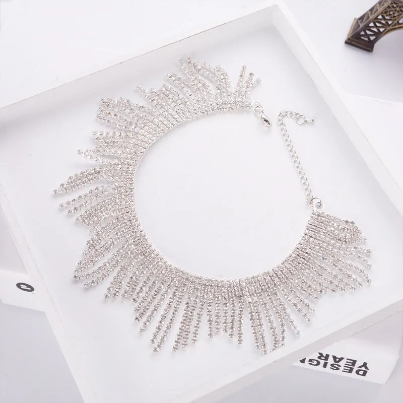 Alloy necklace with gold electroplated finish, geometric tassel pendant, diamond centre, box chain on white background
