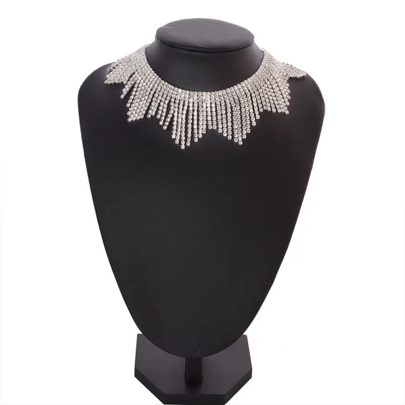 Alloy necklace with gold electroplated finish, geometric tassel pendant, diamond centre, box chain on white background