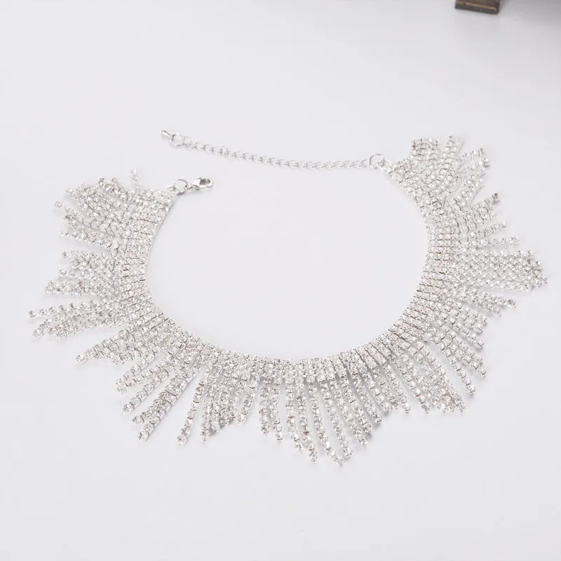 Alloy necklace with gold electroplated finish, geometric tassel pendant, diamond centre, box chain on white background
