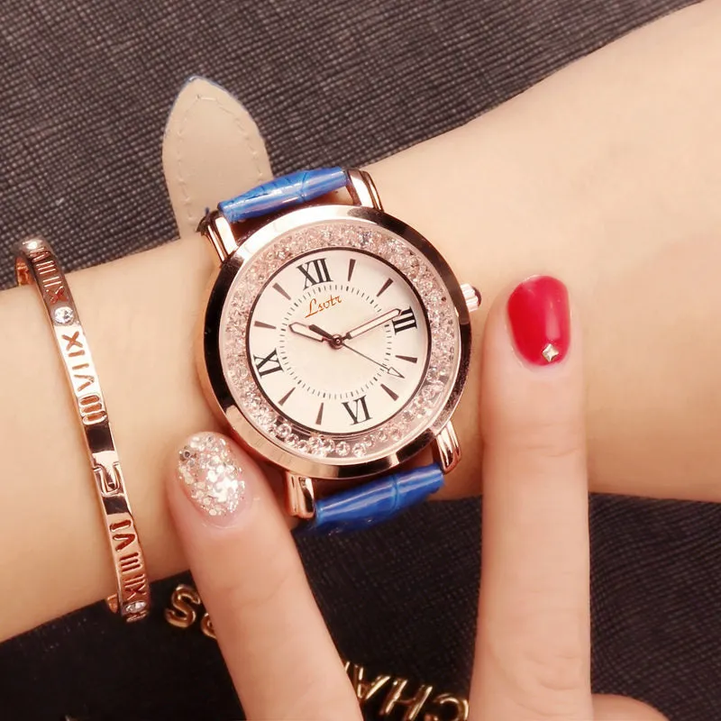 Ladies round metal case watch with white dial, rhinestone crown, and brown PU strap