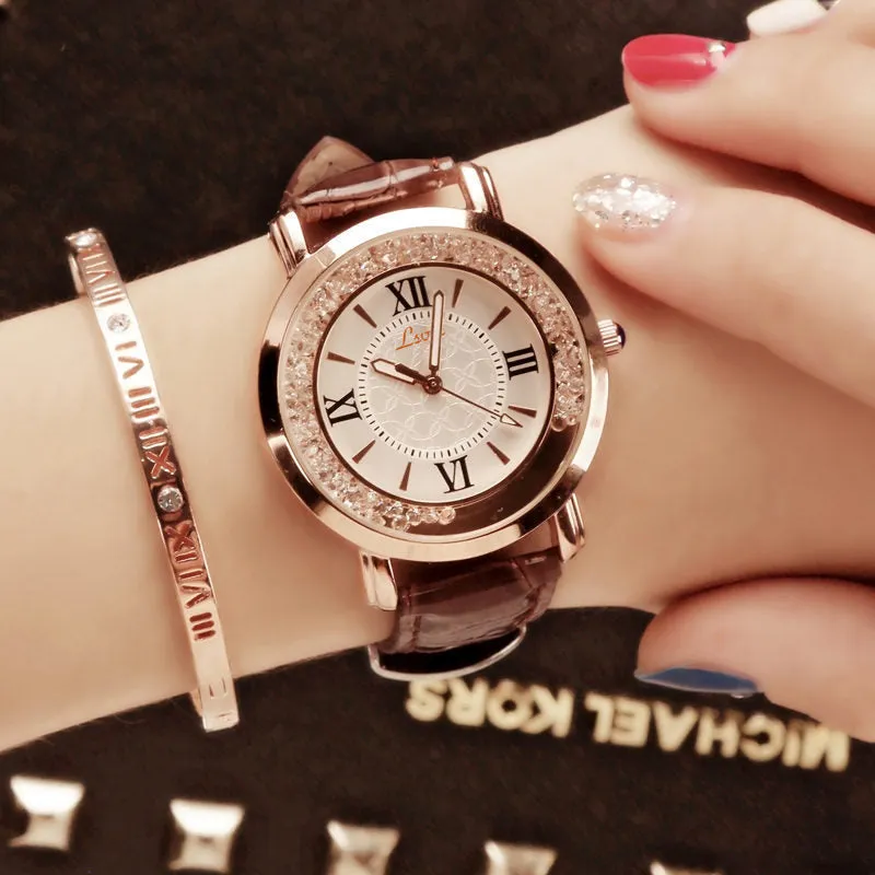 Ladies round metal case watch with white dial, rhinestone crown, and brown PU strap
