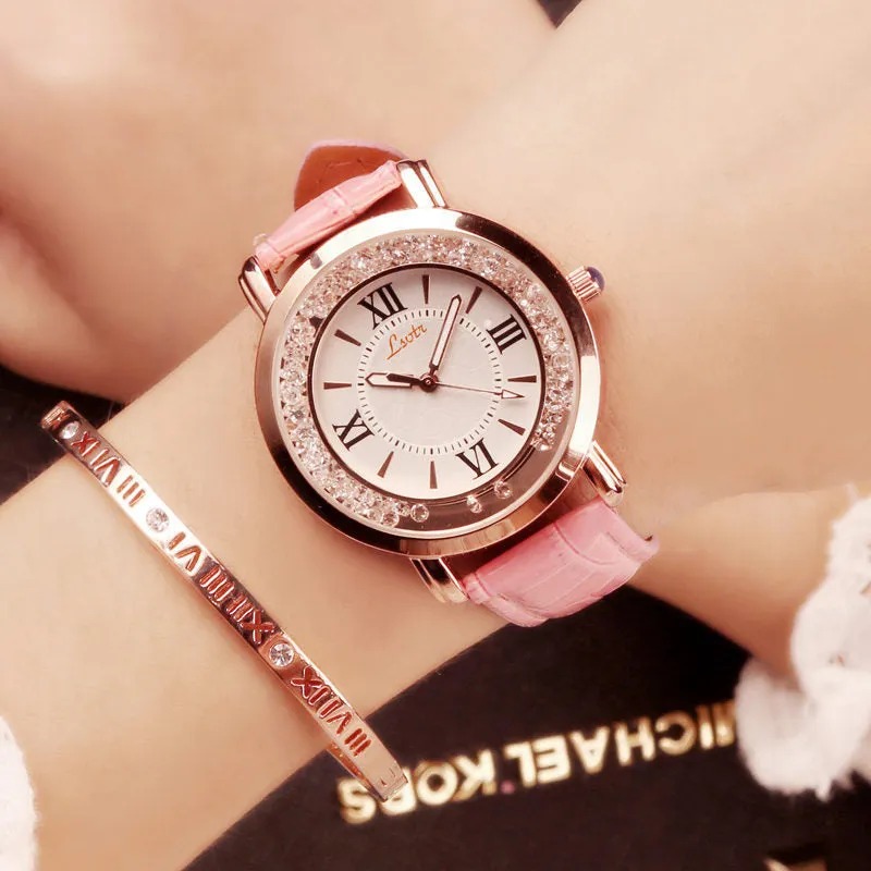 Ladies round metal case watch with white dial, rhinestone crown, and brown PU strap