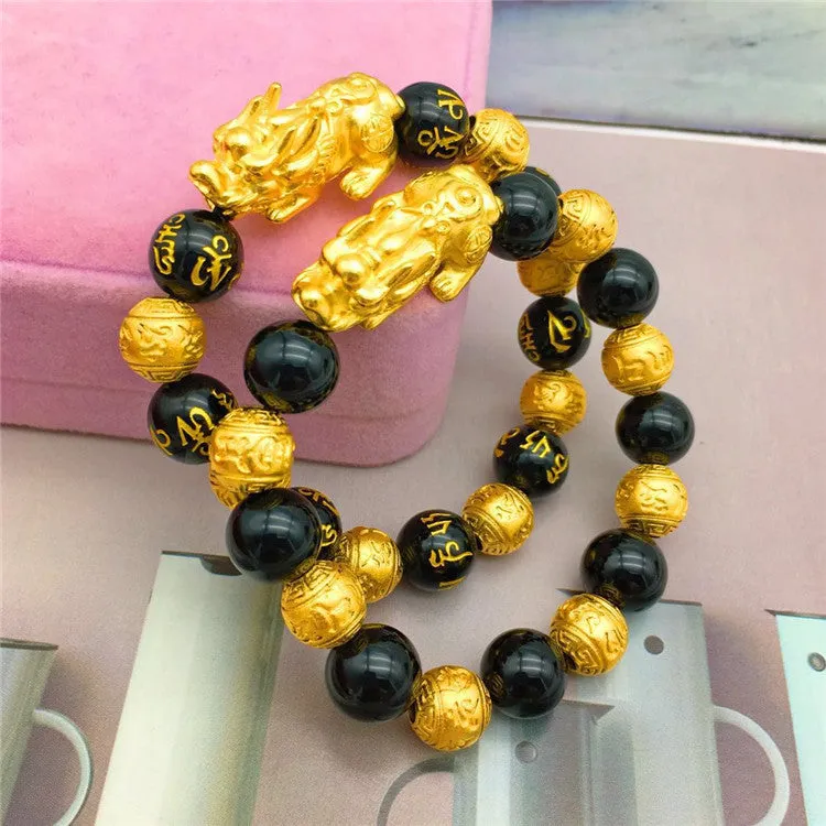 Vietnamese sand gold gold-plated brave bracelet with black beads on display