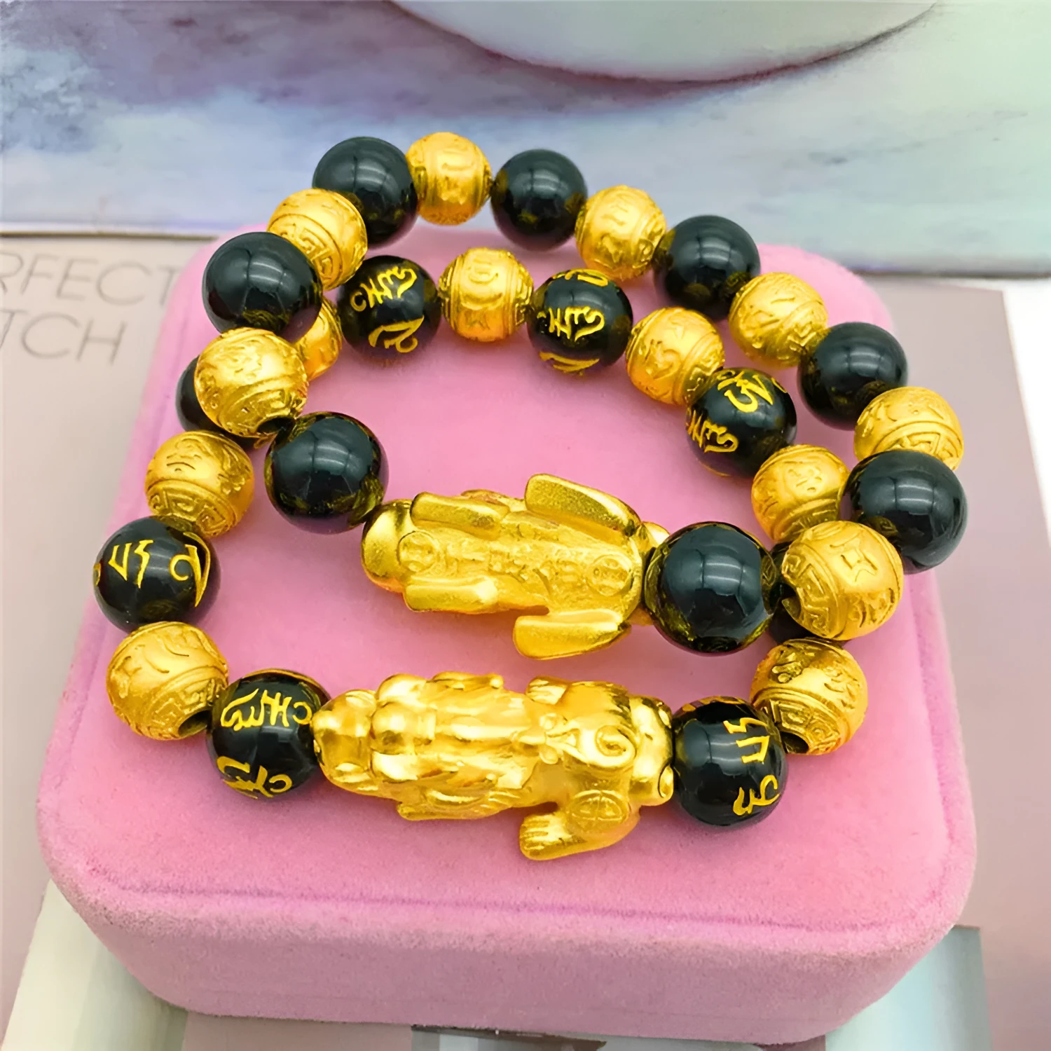 Vietnamese sand gold gold-plated brave bracelet with black beads on display