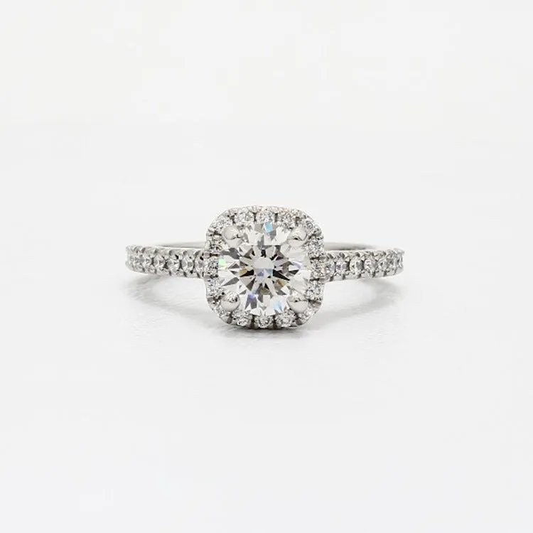 Geometric sculpted platinum alloy ring with diamond insert on white background
