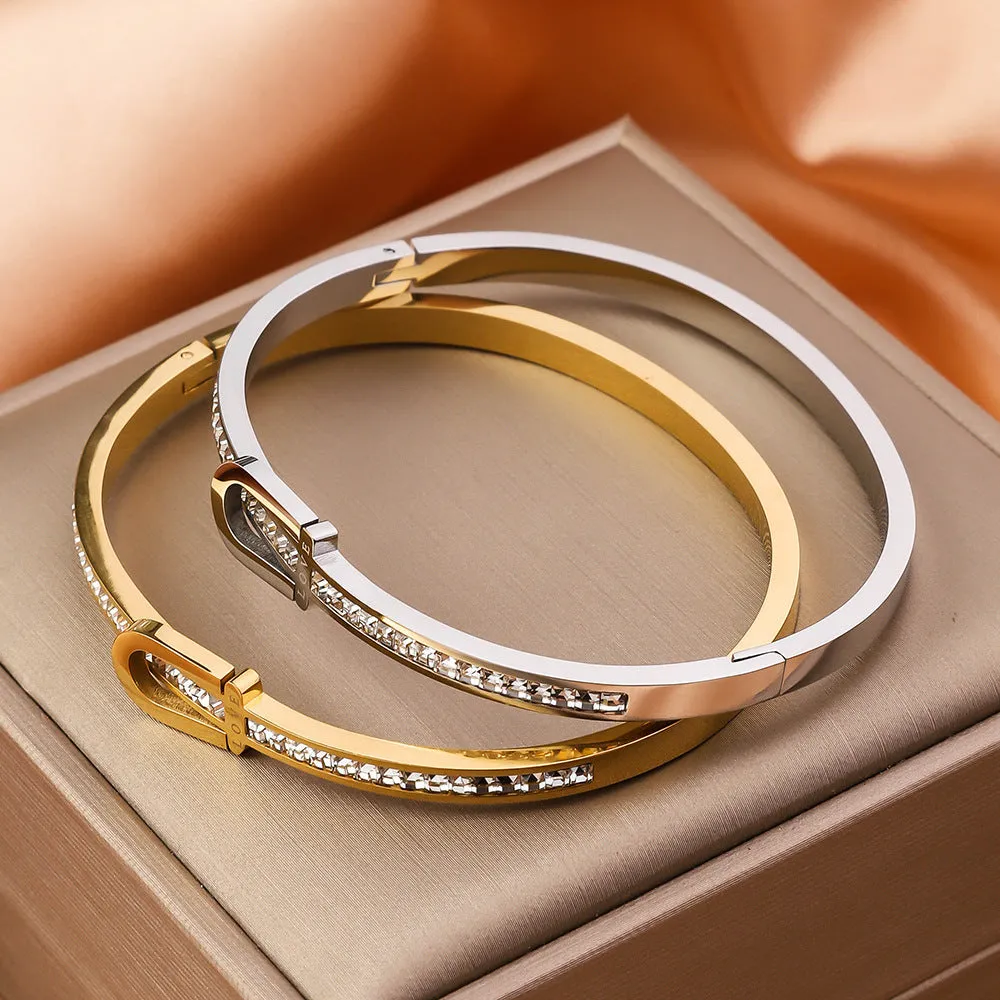 Gold plating titanium steel bracelet for women with electroplated finish, gold colour, on white background