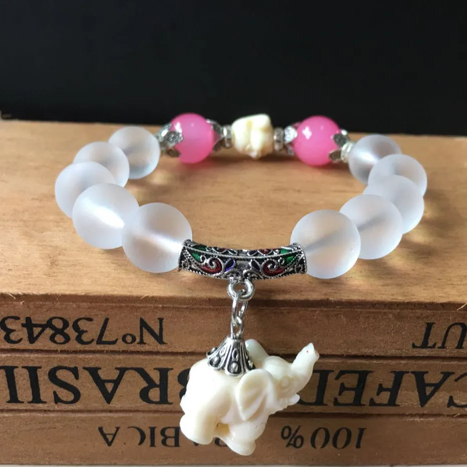 Crystal elephant charm bracelet with clear beads and gold finish metal charm