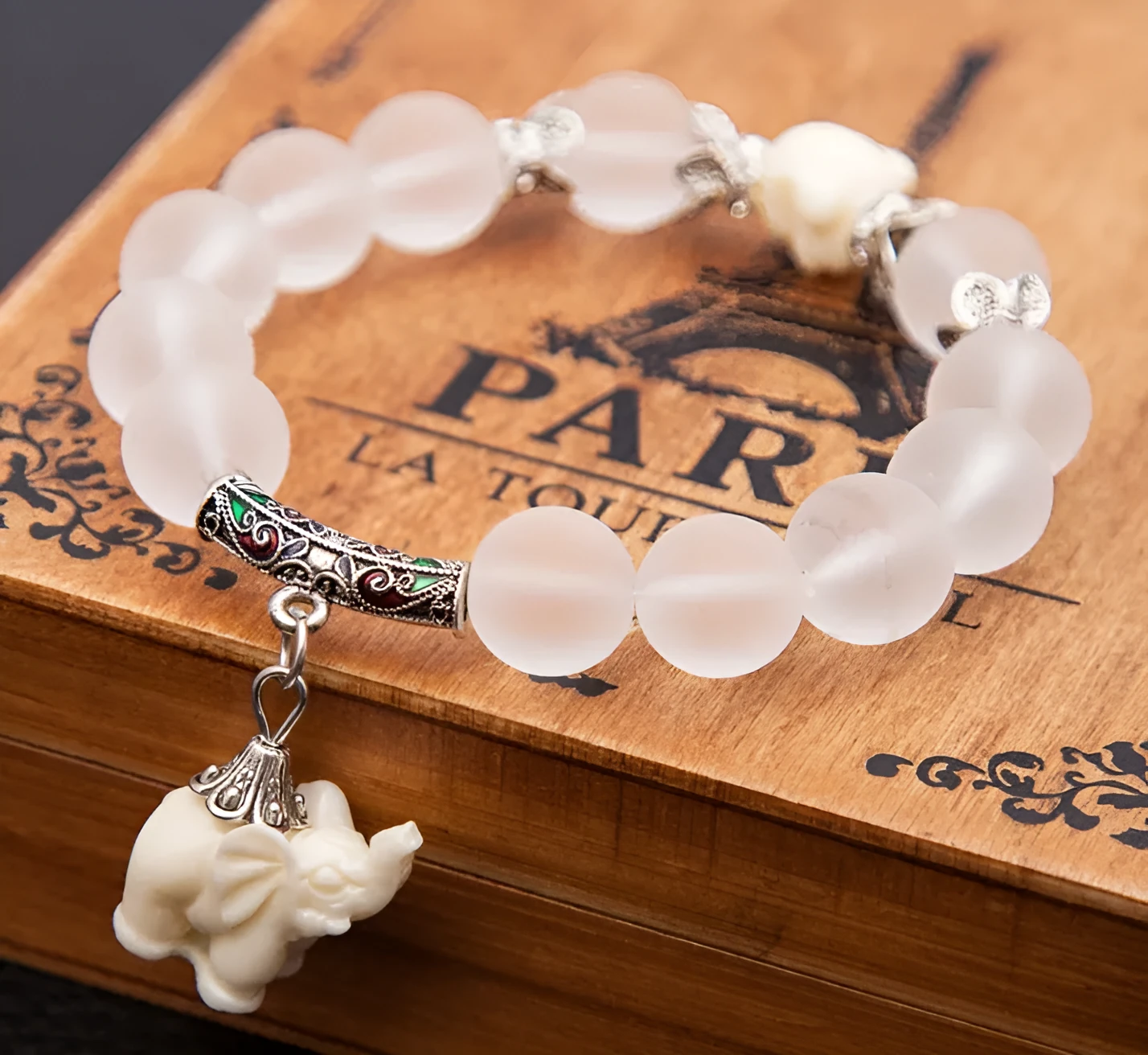 Crystal elephant charm bracelet with clear beads and gold finish metal charm